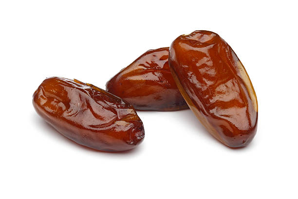 dried dates on white background